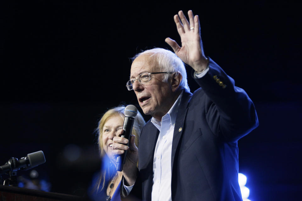 Democratic presidential candidate Sen. Bernie Sanders, I-Vt., with his wife Jane, speaks at his campaign event at Los Angeles Convention Center in Los Angeles, Sunday, March 1, 2020. (AP Photo/Damian Dovarganes)