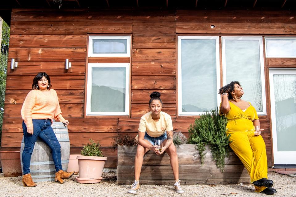 Marlen Porter, Simonne Mitchelson and Justin Trabue outside Trabue's.