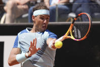 Rafael Nadal returns the ball to John Isner during their match at the Italian Open tennis tournament, in Rome, Wednesday, May 11, 2022. (AP Photo/Andrew Medichini)