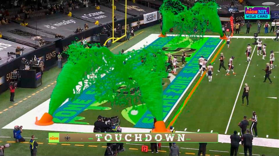 In this Jan. 10, 2021, file image, virtual slime cannons go off in the end zone after a touchdown during Nickelodeon's kid-focused broadcast of the NFL wild-card game.