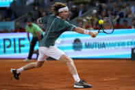 Andrey Rublev, of Russia, competes against Felix Auger-Aliassime, of Canada, during the final match of the Madrid Open tennis tournament in Madrid, Spain, Sunday, May 5, 2024. (AP Photo/Manu Fernandez)