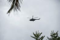 <p>A Myanmar military helicopter flies over Sanhlan village on June 8, 2017. (Photo: Ye Aung Thu/AFP/Getty Images) </p>