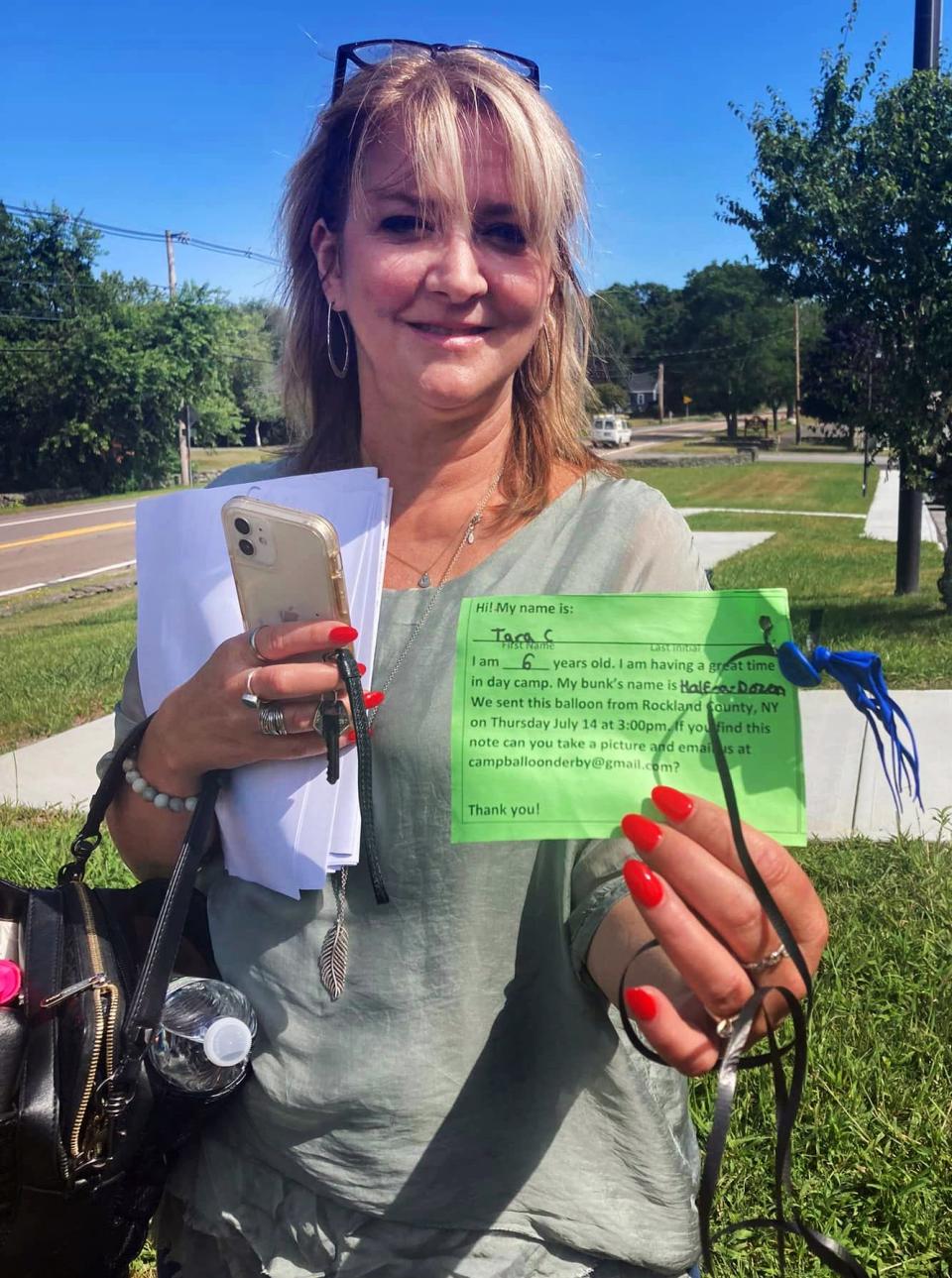 Karin Brady, executive assistant to the Board of Selectmen and town administrator, discovered a message attached to a deflated balloon last Friday on the lawn at Dighton Town Hall. The attached message was from a Balloon Derby put on by a summer camp in Rockland County, New York, and asked that anyone who found the balloon and message to replay with a photo and email to an anonymous email address.