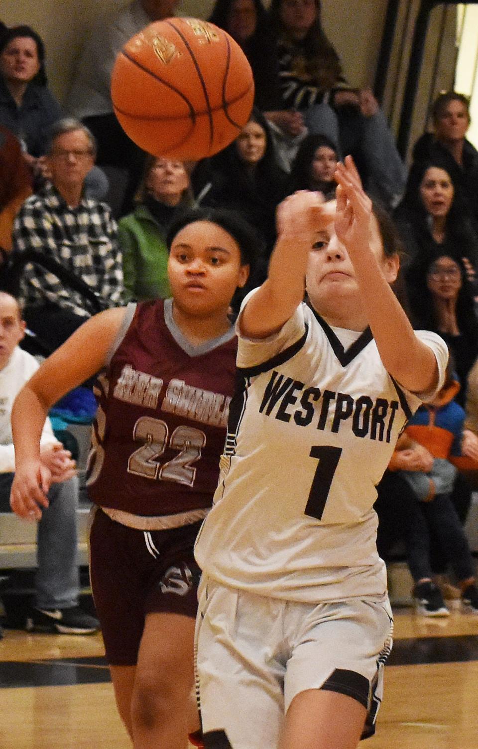 Westport's Julia George passes the ball in front of Ayer Shirley's Maleah Figueroa.