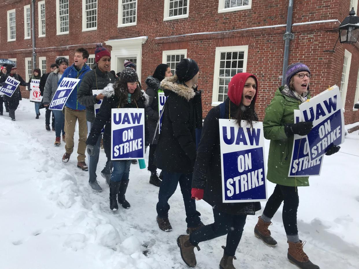 Graduate student workers at Harvard University picket at Harvard Yard Tuesday as they go on strike seeking better pay, health care coverage and protections.