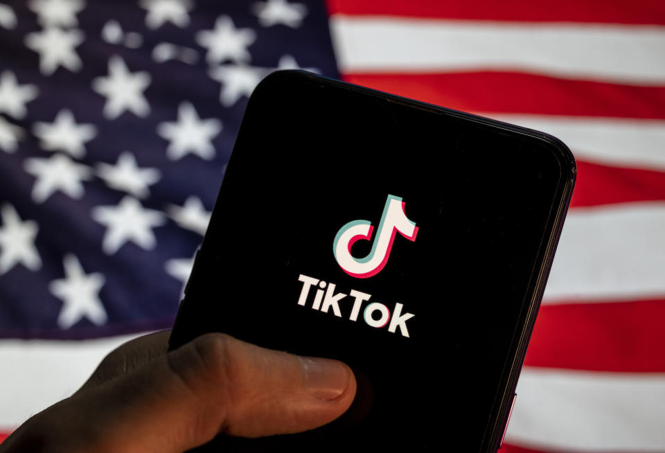 CHINA - 2021/04/02: In this photo illustration the Chinese video-sharing social networking service company TikTok logo is seen on an Android mobile device with United States of America (USA), commonly known as the United States (U.S. or US), flag in the background. (Photo Illustration by Budrul Chukrut/SOPA Images/LightRocket via Getty Images)