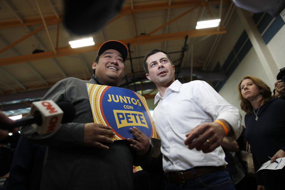 Democratic presidential candidate former South Bend, Ind., Mayor Pete Buttigieg poses for a photo as he visits a caucus site Saturday, Feb. 22, 2020, in Las Vegas. (AP Photo/John Locher)