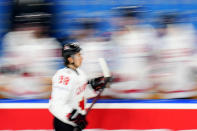 Canada's Connor Bedard celebrates with teammates after scoring his sides fourth goal during the preliminary round match between Great Britain and Canada at the Ice Hockey World Championships in Prague, Czech Republic, Saturday, May 11, 2024. (AP Photo/Petr David Josek)