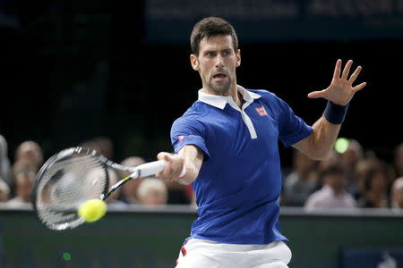 World number one Novak Djokovic of Serbia returns to Britain's Andy Murray during their men's singles final tennis match at the Paris Masters tennis tournament November 8, 2015. REUTERS/Charles Platiau