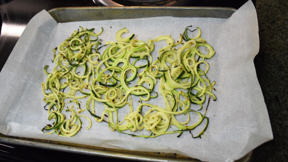 Parchment paper ensures that the zucchini noodles won't stick to the pan. (Courtesy Vidya Rao)