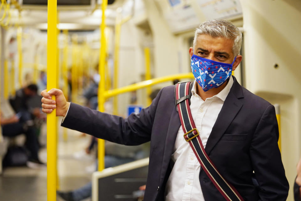 Mayor of London Sadiq Khan wears a mask as he rides on a Circle Line train on the Underground to visit the London Transport Museum. Picture date: Wednesday July 14, 2021.