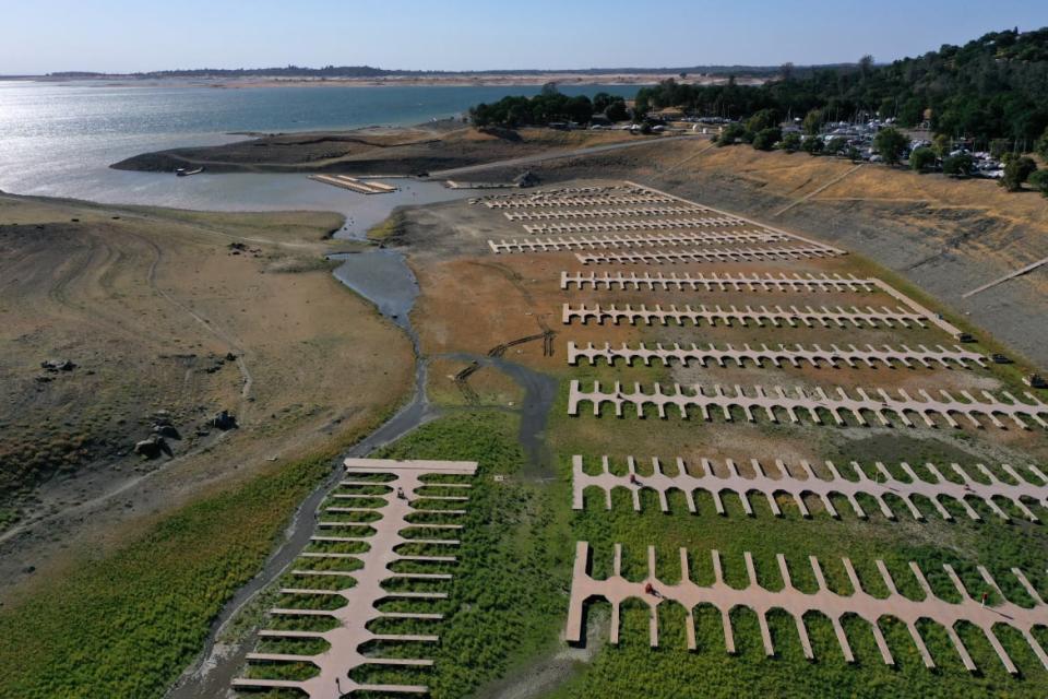 <div class="inline-image__caption"><p>Boat docks at the Browns Ravine Cove sit on dry earth at Folsom Lake on May 10, 2021 in El Dorado Hills, California. </p></div> <div class="inline-image__credit">Justin Sullivan/Getty</div>