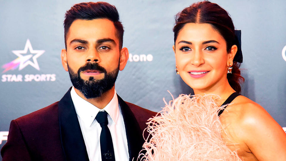 Virat Kohli (pictured left) posing with his wife Bollywood actress Anushka Sharma (pictured right).