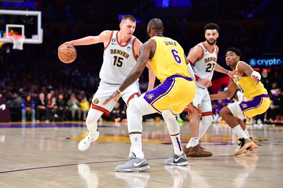 Nuggets center Nikola Jokic drives to the basket against Lakers forward LeBron James in Game 4 of the Western Conference finals.