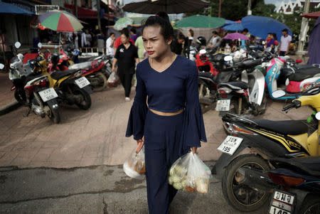 Muay Thai boxer Nong Rose Baan Charoensuk, 21, who is transgender, shops at a market in Phimai district in Nakhon Ratchasima province, Thailand, July 18, 2017. REUTERS/Athit Perawongmetha