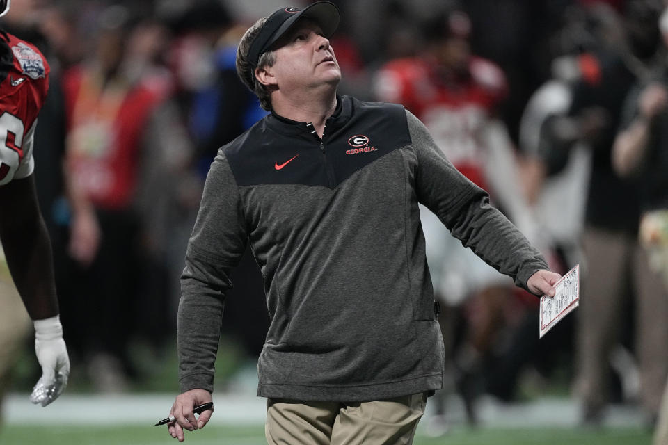 Georgia head coach Kirby Smart walks the turf before the Peach Bowl NCAA college football semifinal playoff game between Georgia and Ohio State, Saturday, Dec. 31, 2022, in Atlanta. (AP Photo/John Bazemore)