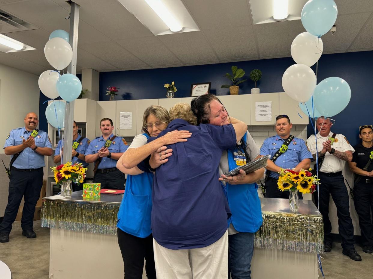 Mary Ann Disanzo hugs the two Walmart employees that saved her life. They were reunited on Thursday, April 25, which happened to be Disanzo's 79th birthday. She suffered a heart attack on April 10.