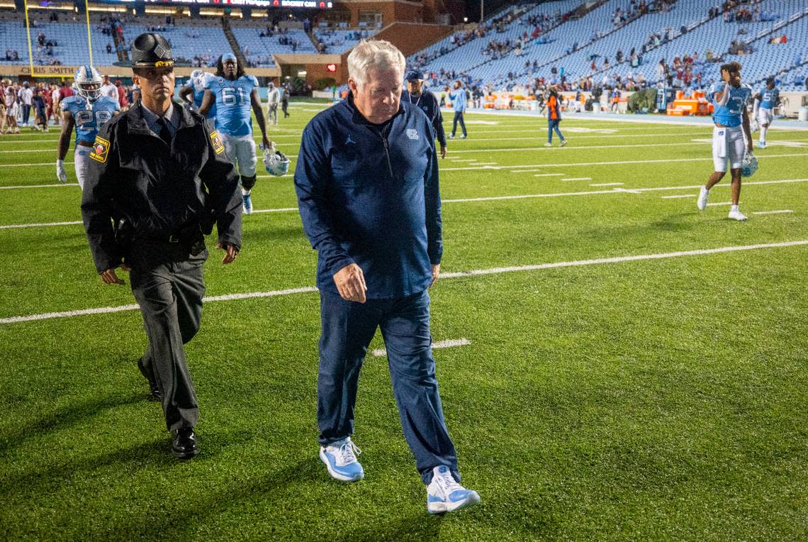 North Carolina coach Mack Brown leave the field following the Tar Heels’ 35-25 loss to Florida State on Saturday, October 9, 2021at Kenan Stadium in Chapel Hill, N.C.