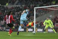 <p>Burnley’s Sam Vokes has a shot on goal, during the English Premier League soccer match between Sunderland and Burnley </p>