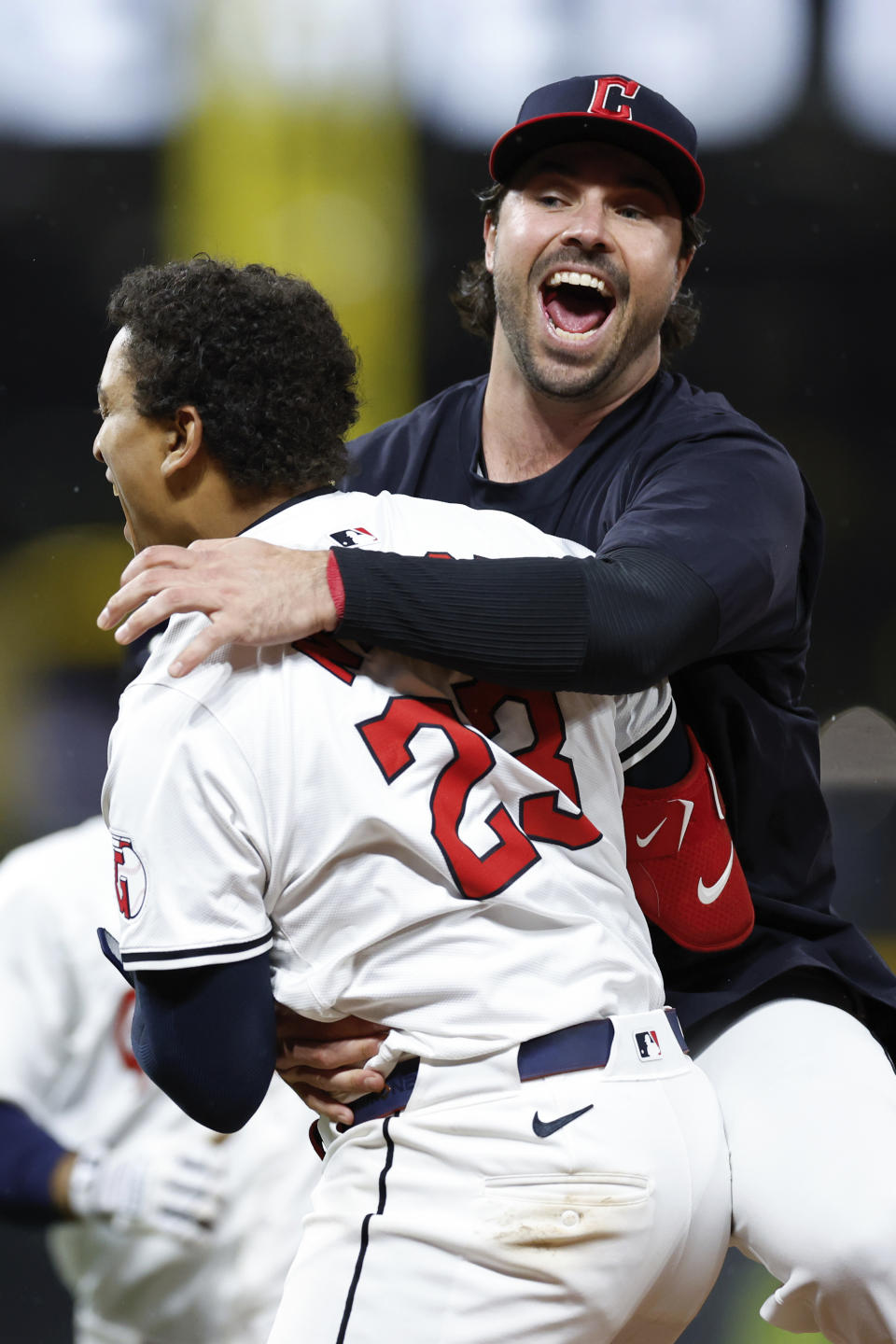 Cleveland Guardians' Bo Naylor (23) celebrates his game winning RBI single off Chicago White Sox pitcher Bryan Shaw with Austin Hedges in a baseball game, Wednesday, April 10, 2024, in Cleveland. (AP Photo/Ron Schwane)