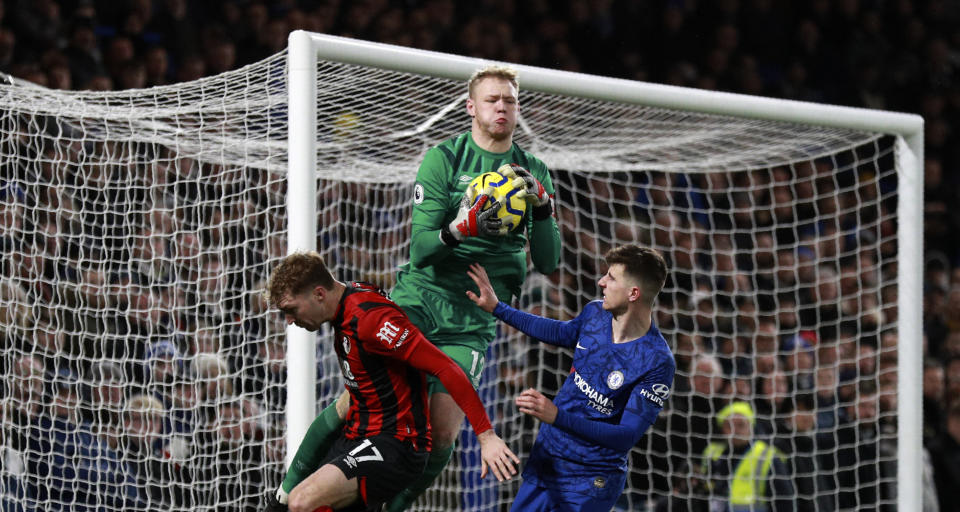 Bournemouth's goalkeeper Aaron Ramsdale, center, makes a save in front of Chelsea's Mason Mount, right, during the English Premier League soccer match between Chelsea and Bournemouth, at Stamford Bridge in London, Saturday, Dec. 14, 2019. (AP Photo/Ian Walton)