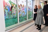 <p>For a visit to Birmingham Children's Hospital, Camilla wore an A-line, checkered coat with a blue brooch and black boots. </p>