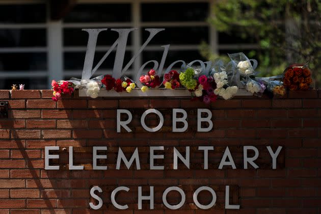 Flowers are placed around a welcome sign outside Robb Elementary School in Uvalde, Texas to honor the victims killed in a mass shooting at the school. (Photo: via Associated Press)