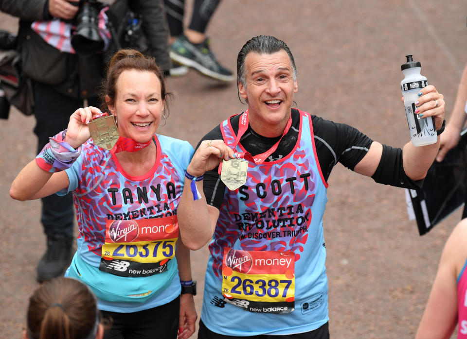 Tanya Franks and Scott Mitchell pose with their medals after completing the Virgin London Marathon 2019 on April 28, 2019 in London, United Kingdom. (Photo by Karwai Tang/WireImage)