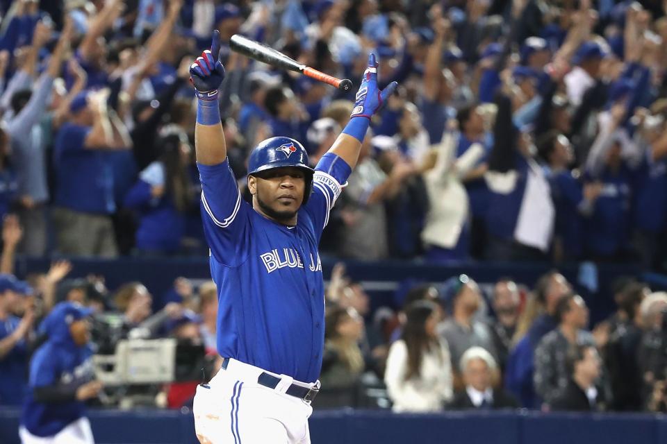 <p>A year after Jose Bautista delivered the bat flip heard 'round the world, it was Edwin Encarnacion's turn to come through with home run heroics in the postseason. Encarnacion hit a walk-off extra-innings blast against Baltimore in the AL wild-card game to kick off a Blue Jays postseason run that would end in the ALCS for a second straight season. (Getty Images) </p>