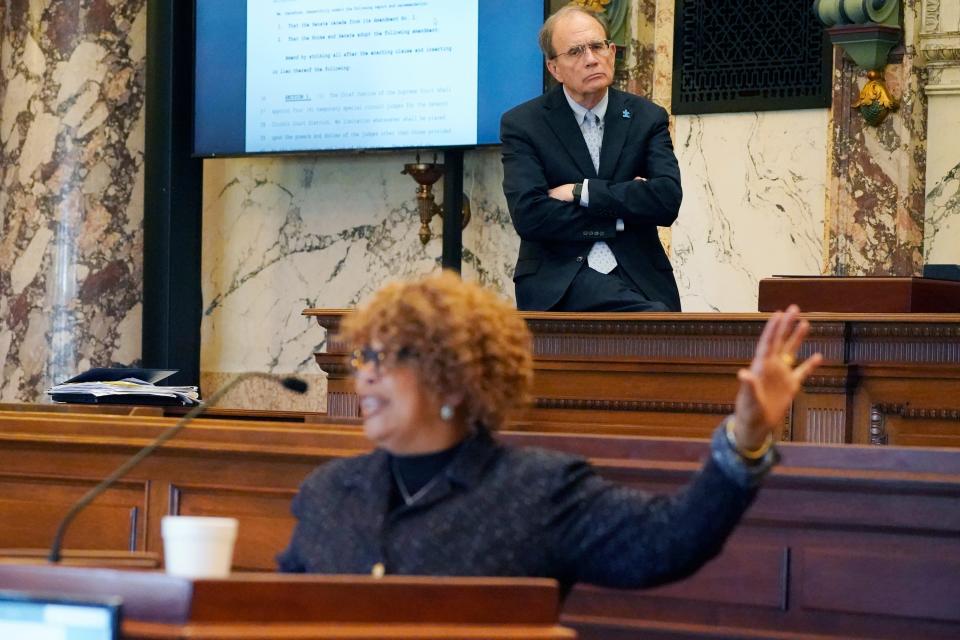 Lt. Gov. Delbert Hosemann, stands in the background as Democratic State Sen. Barbara Blackmon of Canton speaks against passage of the controversial Jackson Capitol Complex Improvement District bill before a chamber of Black lawmakers and a few white Republican lawmakers, Thursday, March 30, 2023, at the Capitol in Jackson, Miss. The majority of lawmakers left the chamber as opponents to the bill spoke against it. (AP Photo/Rogelio V. Solis)