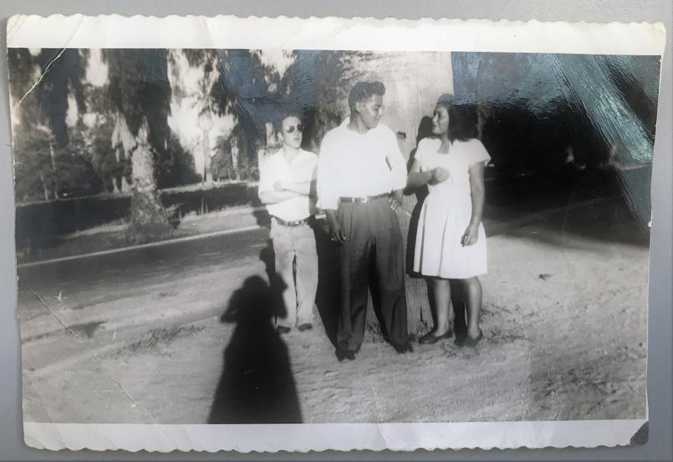 Daniel Carmelo, center, and Anna Timmons, right, pose for a snapshot before the couple married. Carmelo’s mother and father met at Sherman Indian High School in Riverside. They attended the boarding school voluntarily in the 1940s.