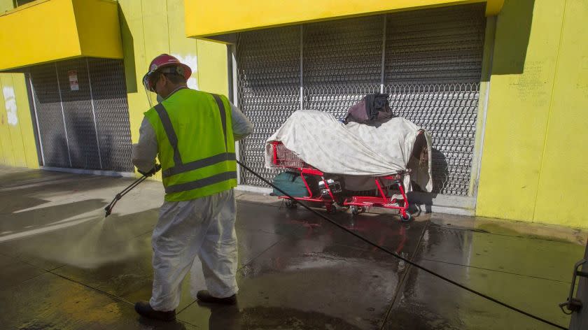 SAN DIEGO CA.- Sept. 11, 2017, Clean Harbors, a private contractor, power washed sidewalks downtown in the area of 17th and Imperial with a bleach solution in an attempt to stop the spread of hepatitis A that is making it's way through the homeless community. Clean Harbors employee Jose Salinas was the one doing the pressure washing. PHOTO/JOHN GIBBINS, Staff photographer, San Diego Union-Tribune) copyright 2017