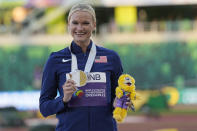 Gold medalist Katie Nageotte, of the United States, poses during a medal ceremony for the women's pole vault final at the World Athletics Championships on Sunday, July 17, 2022, in Eugene, Ore. (AP Photo/David J. Phillip)
