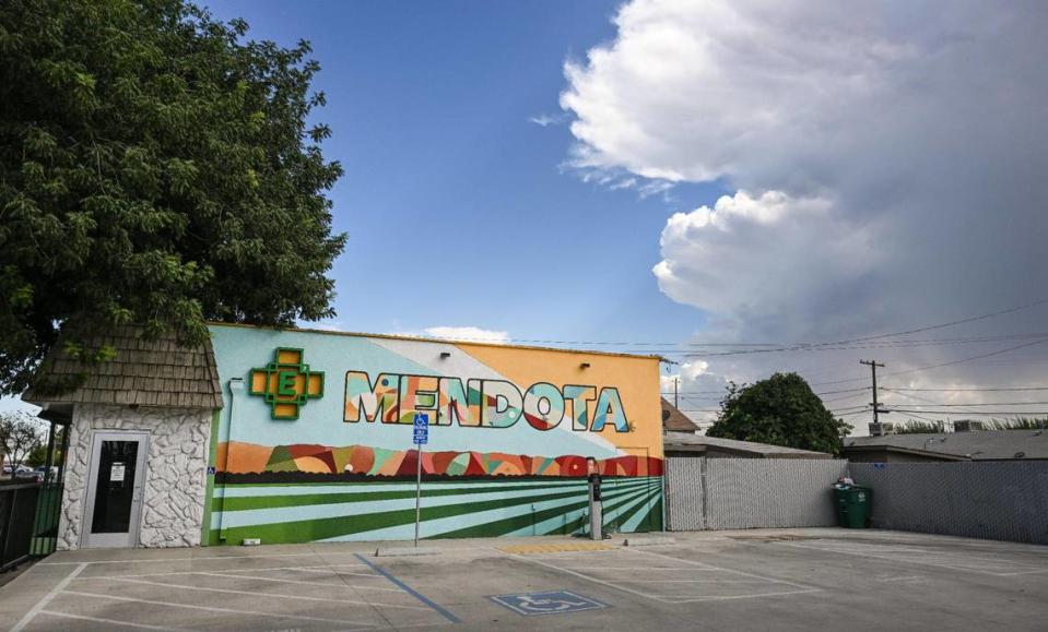 A colorful mural celebrates the heritage and agriculture among the residents of the city of Mendota outside the Element 7 Cannabis Dispensary on Thursday, Aug. 17, 2023.