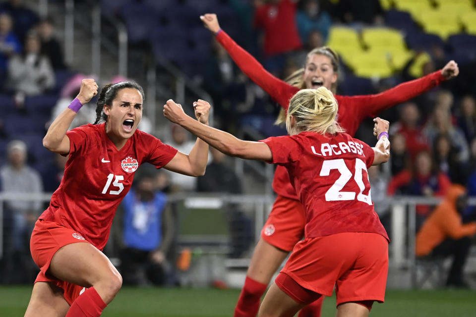 Canada forward Evelyne Viens (15) celebrates with Cloe Lacasse (20) after Viens scored a goal against Brazil during the second half of a SheBelieves Cup soccer match Sunday, Feb. 19, 2023, in Nashville, Tenn. Canada won 2-0.(AP Photo/Mark Zaleski)
