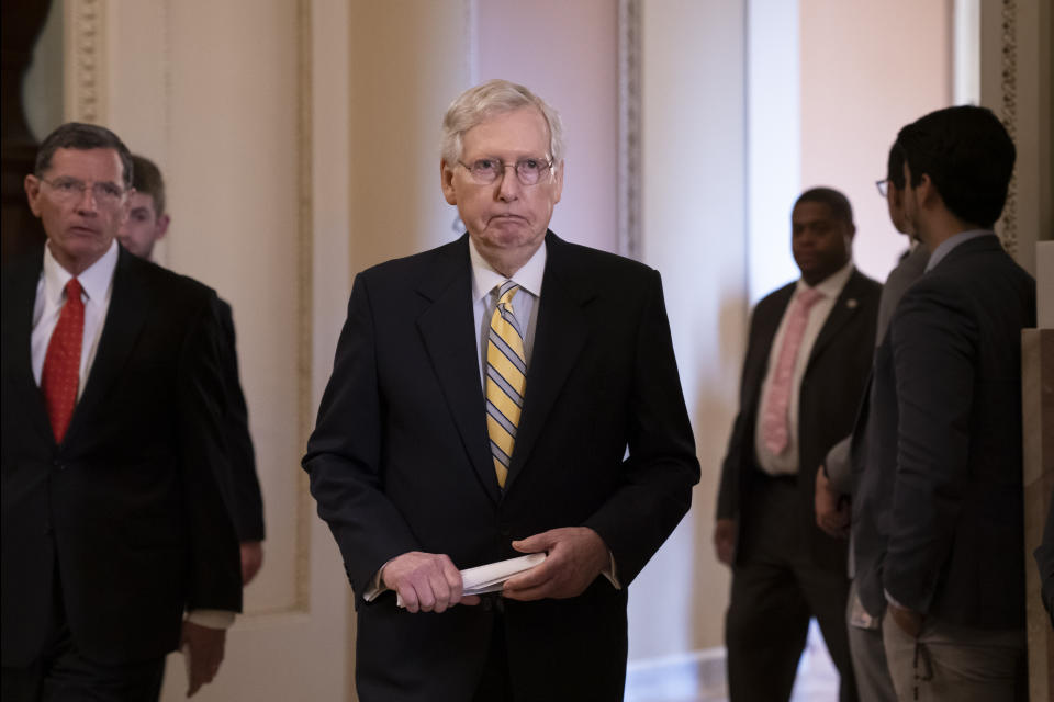 Senate Majority Leader Mitch McConnell, R-Ky., joined at left by Sen. John Barrasso, R-Wyo., arrives to speak to reporters during a news conference at the Capitol in Washington, Tuesday, Sept. 17, 2019. (AP Photo/J. Scott Applewhite)