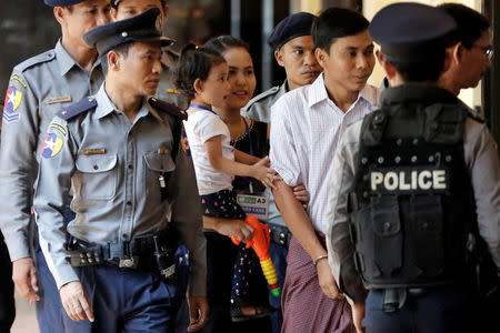 Moe Thin Wai Zin, daughter of detained Reuters journalist Kyaw Soe Oo reacts as he arrives for a court hearing in Yangon, Myanmar April 20, 2018 . REUTERS/Ann Wang