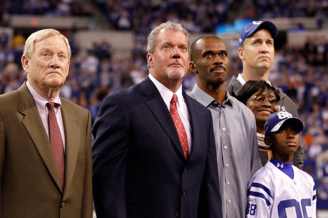 <p>Sam Riche/Tribune News Service via Getty</p> Young Marvin Harrison Jr. stands on sideline alongside dad Marvin Harrison and Peyton Manning