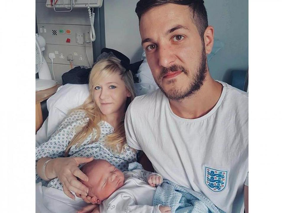 Chris Gard and Connie Yates with their son Charlie Gard (PA)