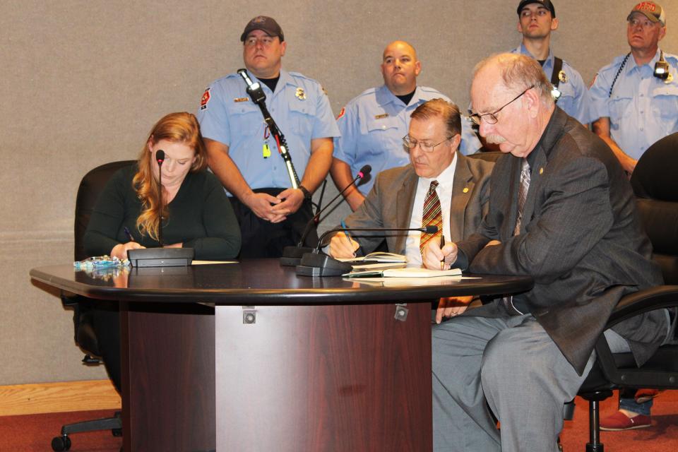 Oak Ridge City Attorney Tammy Rackard, from left, new City Manager Randy Hemann and Deputy City Manager Jack Suggs take notes during the Thursday, Nov. 9, work session. Council and Hemann praised Suggs for his work as interim city manager.