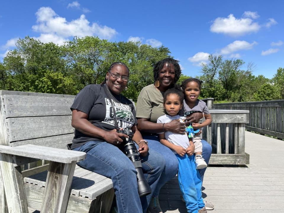 Bernice Coles (L) and Betty Cottle pose with Cottle's two grandchildren at the John Heinz National Wildlife Refuge in Philadelphia on Saturday, May 28, 2022. The two met while birding in the park and enjoy taking photos of the local wildlife. They find comfort in birding together, as many local birding groups are dominated by white participants. "It's like I've known her forever," Coles said.