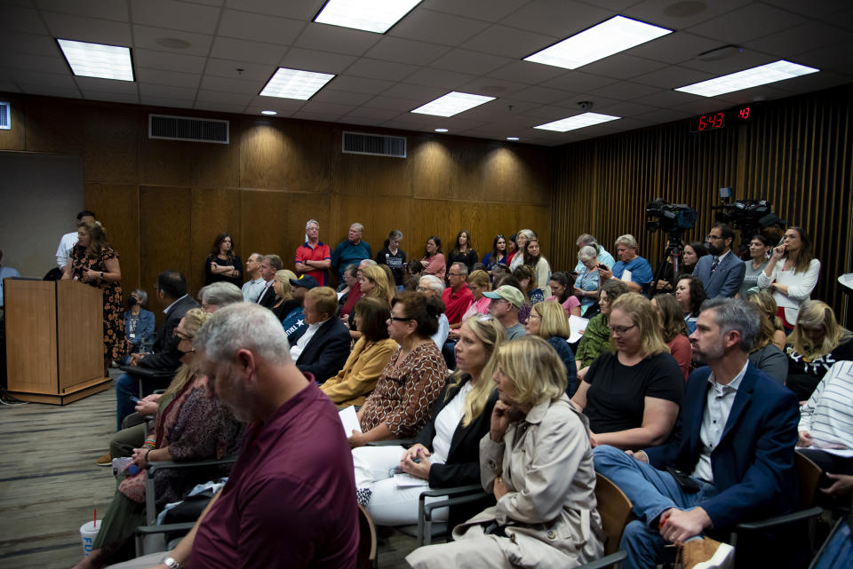 Image: Attendees listen to a member of the public speak during a Grapevine-Colleyville Independent School District school board meeting in Grapevine, Texas on Aug. 22, 2022. (Emil T. Lippe for NBC News)