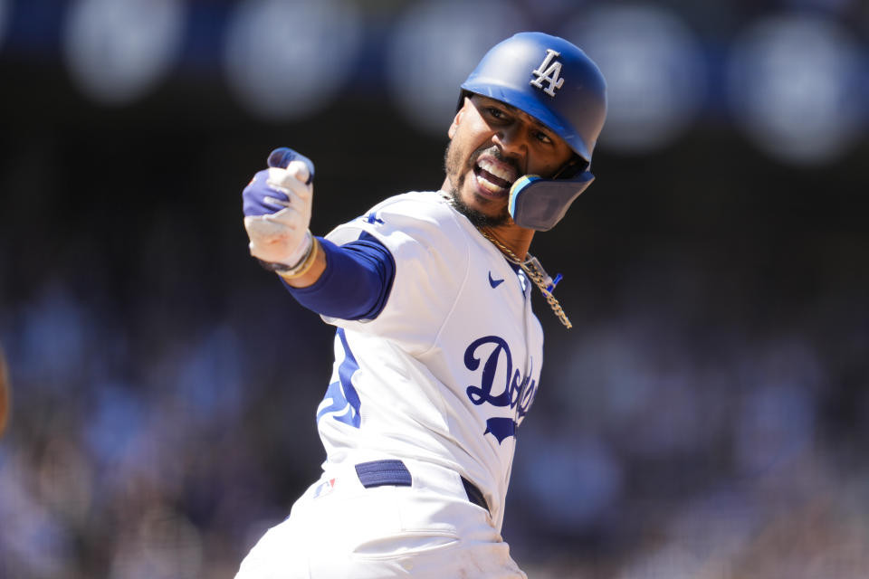 Los Angeles Dodgers' Mookie Betts reacts after hitting a home run during the eighth inning of a baseball game against the Tampa Bay Rays in Los Angeles, Sunday, Aug. 25, 2024. Shohei Ohtani also scored. (AP Photo/Ashley Landis)