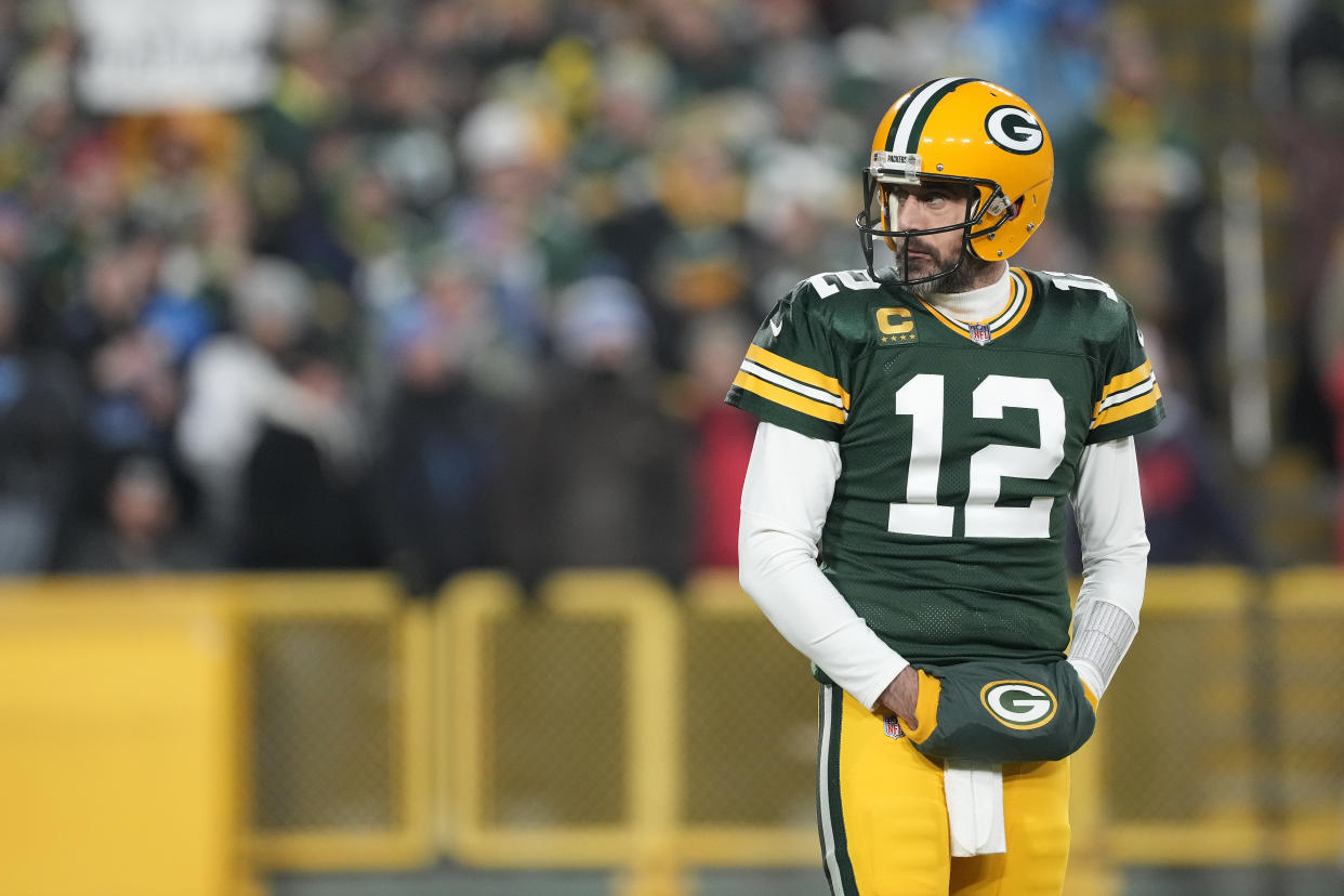 GREEN BAY, WISCONSIN - JANUARY 08: Aaron Rodgers #12 of the Green Bay Packers looks on against the Detroit Lions during the first half at Lambeau Field on January 08, 2023 in Green Bay, Wisconsin. (Photo by Patrick McDermott/Getty Images)