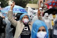 Nurses protest to demand government social security for health workers, which includes health care and a pension, the day before International Nurses Day in Asuncion, Paraguay, Tuesday, May 11, 2021. (AP Photo/Jorge Saenz)