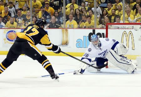 May 26, 2016; Pittsburgh, PA, USA; Tampa Bay Lightning goalie Andrei Vasilevskiy (88) makes a save against Pittsburgh Penguins right wing Bryan Rust (17) during the third period in game seven of the Eastern Conference Final of the 2016 Stanley Cup Playoffs at the CONSOL Energy Center. The Penguins won the game 2-1 and the Eastern Conference Championship four games to three. Mandatory Credit: Charles LeClaire-USA TODAY Sports