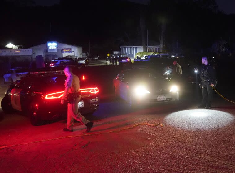 Law enforcement personnel control the scene of a shooting Monday, Jan. 23, 2023, in Half Moon Bay, Calif. Multiple people were killed in two related shootings Monday at a mushroom farm and a trucking firm in a coastal community south of San Francisco, and officials say a suspect is in custody. (AP Photo/Jeff Chiu)