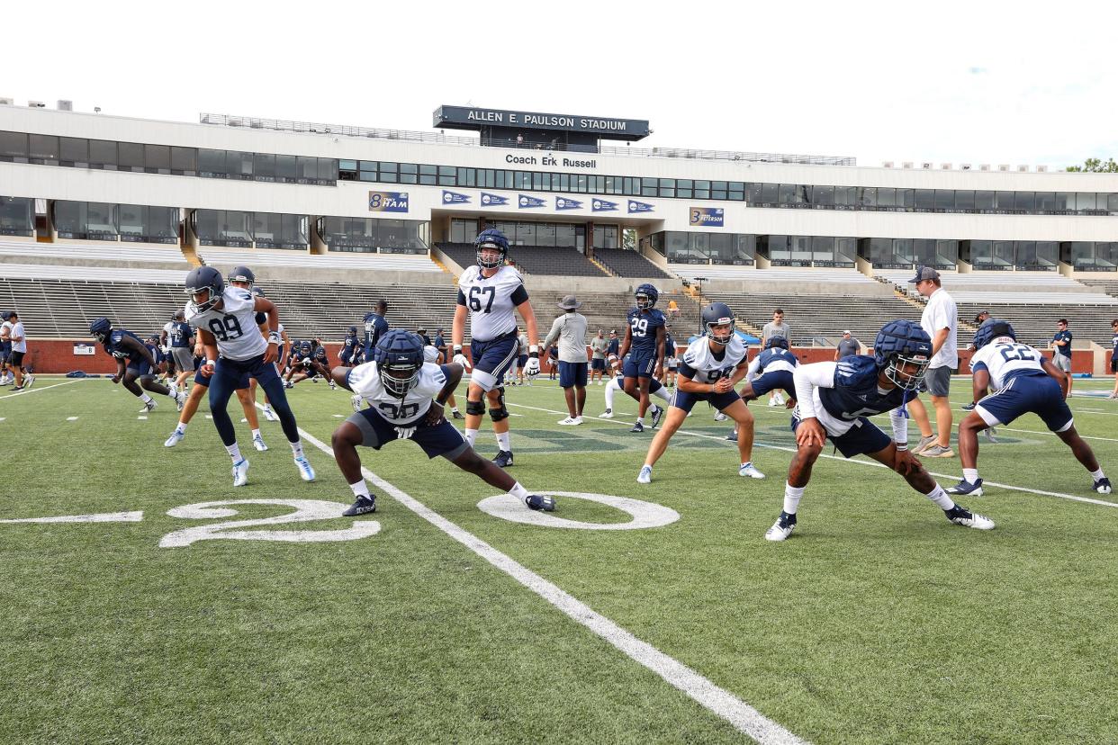 Georgia Southern players warm-up during the first practice of the season on Wednesday morning at Paulson Stadium.