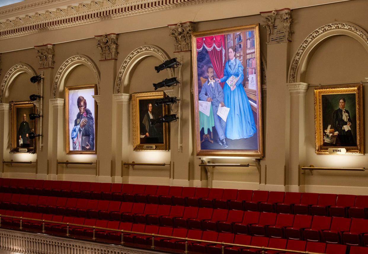 New portrait of Frederick Douglass and William and Martha Brown hang inside Mechanics Hall on Thursday.