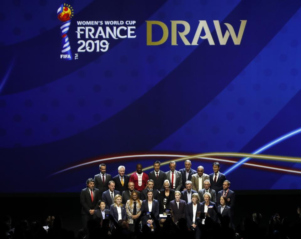 Participant teams coaches pose during the women's soccer World Cup France 2019 draw, in Boulogne-Billancourt, outside Paris, Saturday, Dec. 8, 2018. (AP Photo/Christophe Ena)